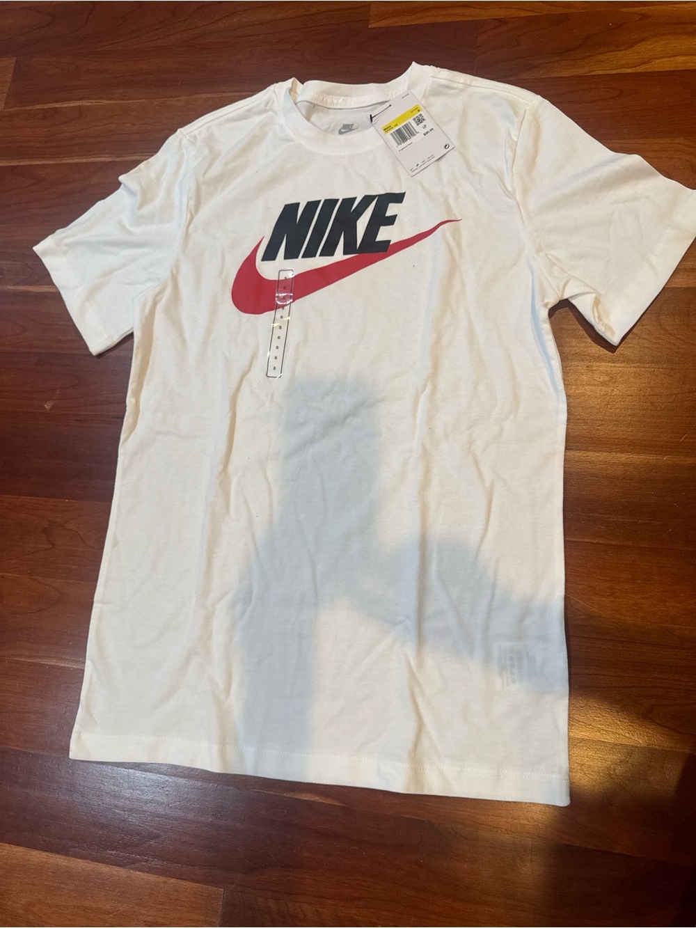 Nike White Short-Sleeve Tee with Red Swoosh and Black Logo